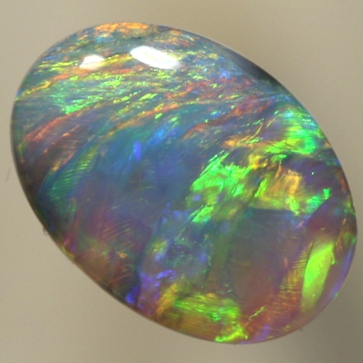 SOLID CRYSTAL OPAL Green and orange fire moves from side to side